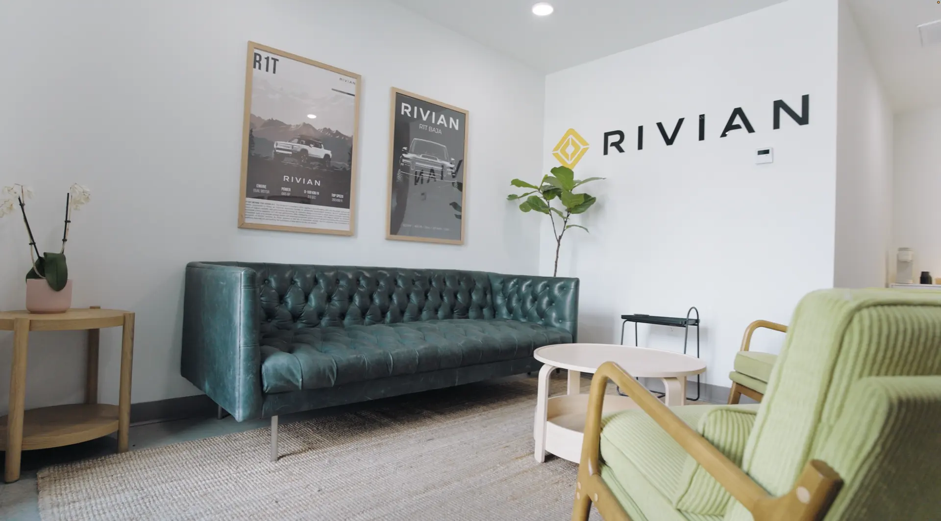 The customer lounge, with framed prints above a green sofa and armchairs.